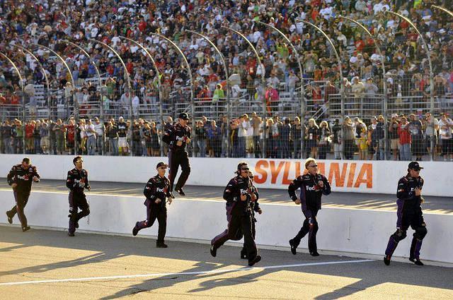 Denny's crew running to celebrate his win