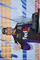 Denny Hamlin with the trophy and 5 wins