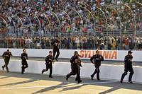 Denny's crew running to celebrate his win