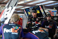 Denny looks on as his car is being worked on